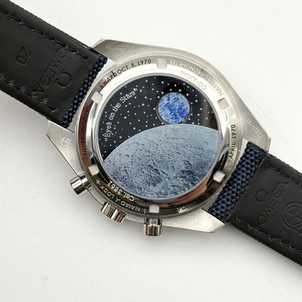 Rep Omega Speedmaster Snoopy chronograph with blue and silver dial inspired by space exploration